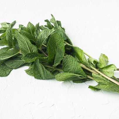 fresh-mint-leaves-herb-set-white-stone